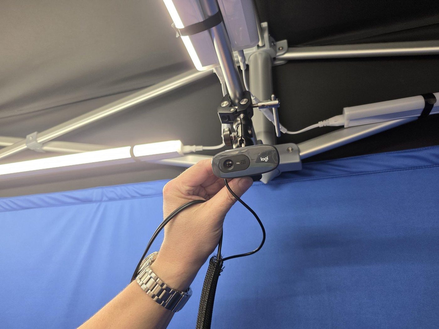 Camera mounted to ceiling clamp